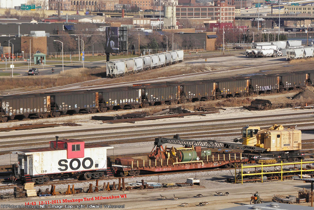 Milwaukee Road in the middle of the Soo crane and caboose